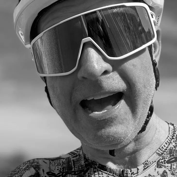 David Sommerville racing in cycling kit and sunglasses.
